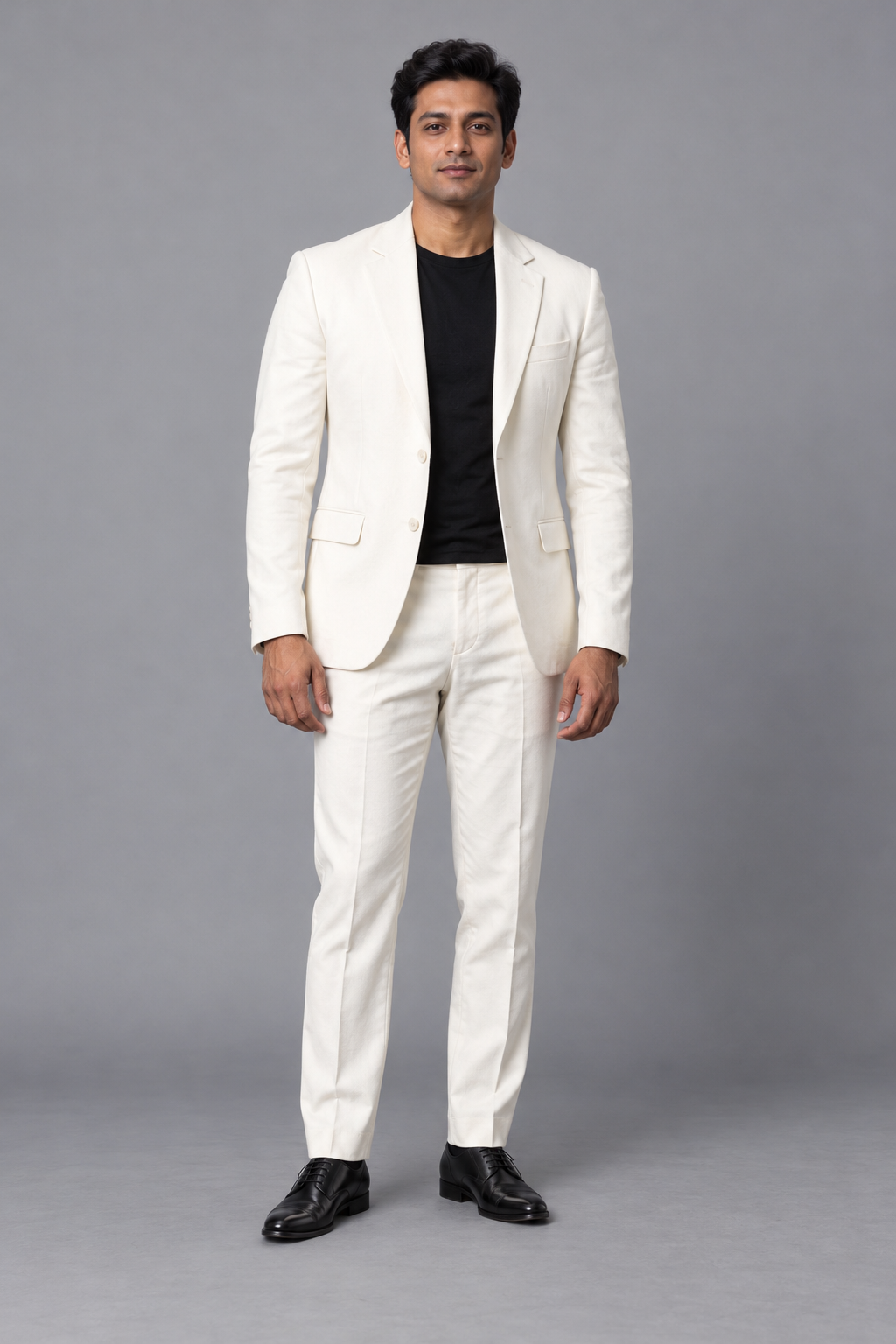 Full-body reference of an adult man in an ivory suit
